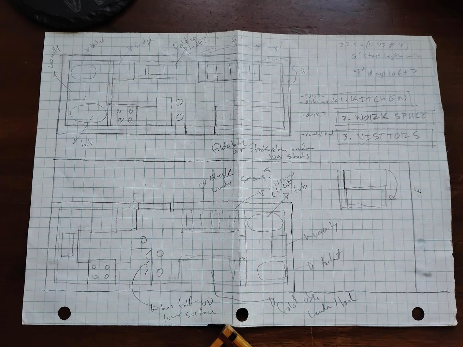 Pencil sketch on graph paper of two different tiny house layout ideas